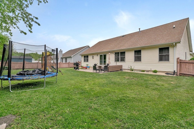 817 W 3rd St, Braidwood, IL 60408 - rear view of property with a trampoline, a patio, outdoor lounge area, and roof with shingles