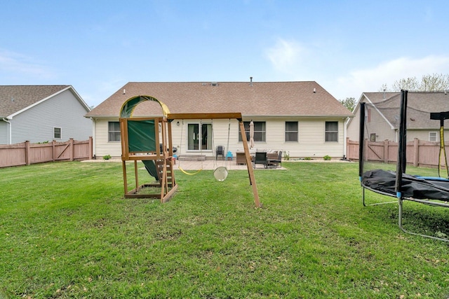 817 W 3rd St, Braidwood, IL 60408 - rear view of property with a trampoline and a patio area