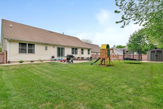 817 W 3rd St, Braidwood, IL 60408 - rear view of property featuring a patio area, a playground, a trampoline, and roof with shingles