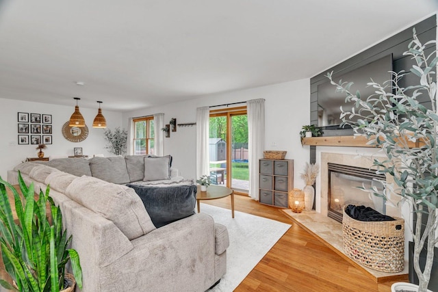 817 W 3rd St, Braidwood, IL 60408 - living area featuring a tile fireplace and wood finished floors