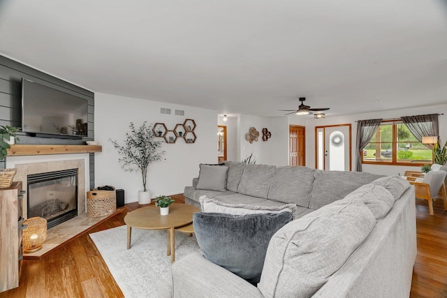 817 W 3rd St, Braidwood, IL 60408 - living room with ceiling fan, a fireplace, and wood finished floors