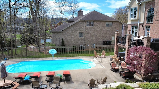 242 Hampshire Ct, New Lenox, IL 60451 - view of swimming pool featuring fence, a patio area, and central AC