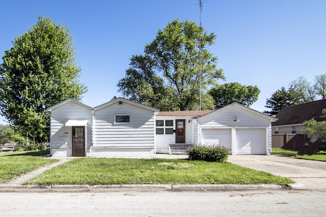1195 W Williams St, Kankakee, IL 60901 - view of front of house featuring entry steps, driveway, an attached garage, and a front lawn