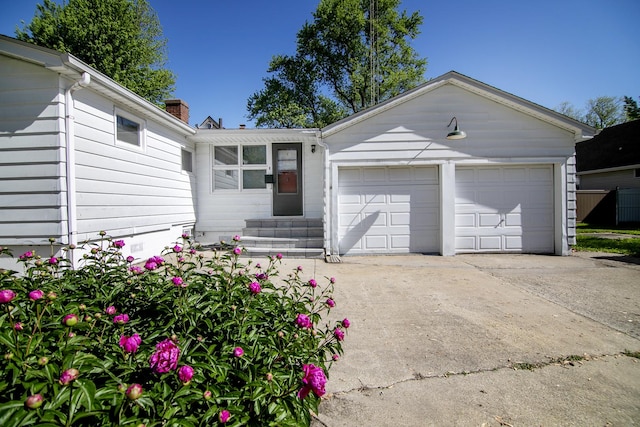 1195 W Williams St, Kankakee, IL 60901 - single story home featuring an attached garage, driveway, entry steps, and a chimney