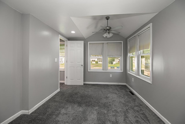 1195 W Williams St, Kankakee, IL 60901 - empty room with dark colored carpet, a ceiling fan, vaulted ceiling, baseboards, and recessed lighting