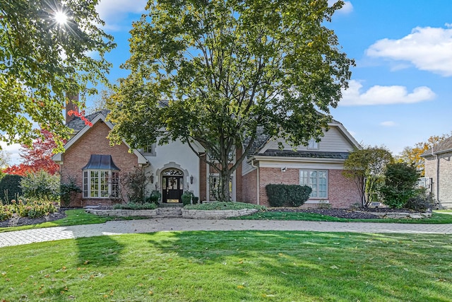 2 Hampton Ct, Burr Ridge, IL 60527 - view of front of property featuring a front yard, brick siding, french doors, and a chimney