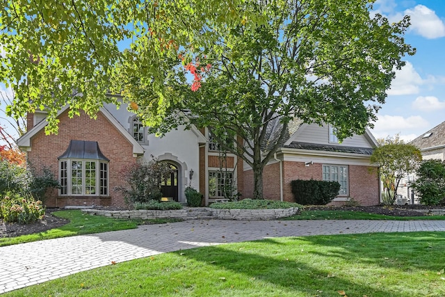 2 Hampton Ct, Burr Ridge, IL 60527 - view of front of house featuring brick siding and a front yard