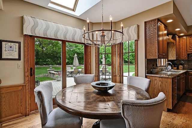 2 Hampton Ct, Burr Ridge, IL 60527 - dining room with a chandelier, light wood-type flooring, a skylight, and recessed lighting