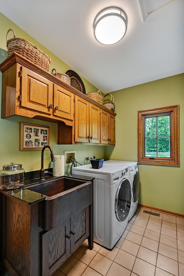 2 Hampton Ct, Burr Ridge, IL 60527 - laundry area featuring cabinet space, washer and clothes dryer, light tile patterned flooring, and baseboards