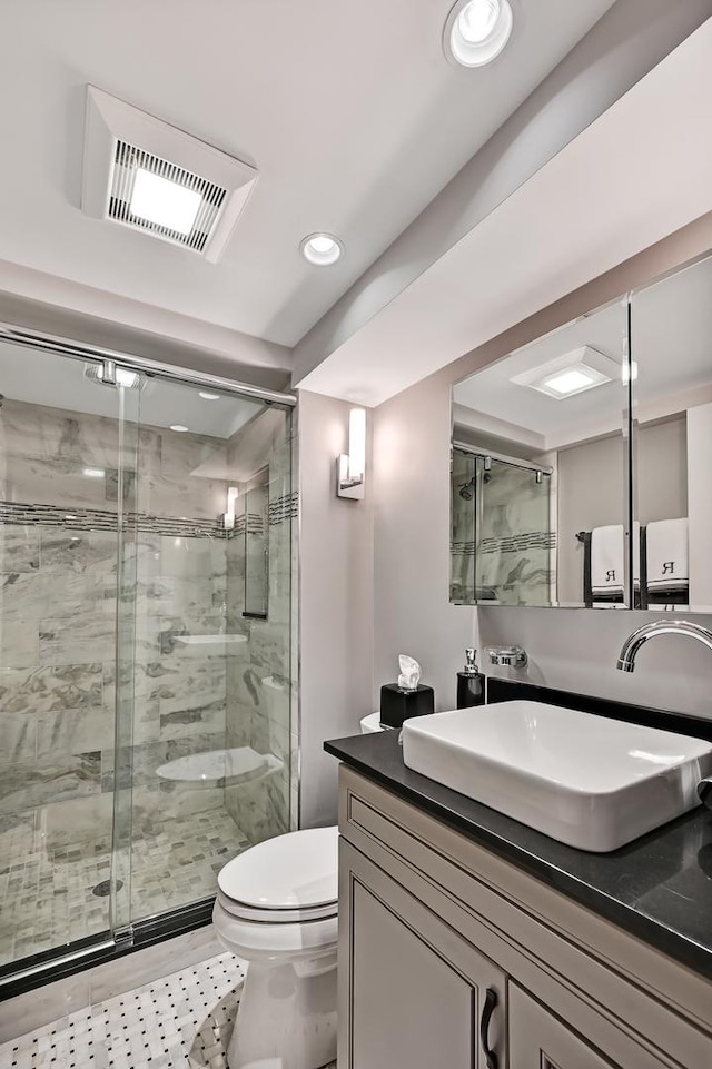 2 Hampton Ct, Burr Ridge, IL 60527 - bathroom featuring a shower stall, vanity, toilet, and recessed lighting