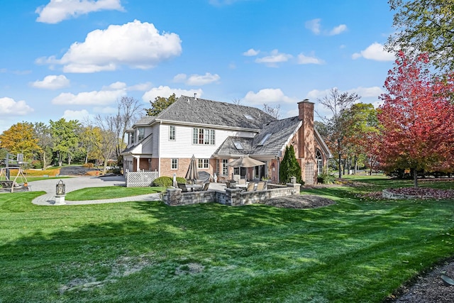 2 Hampton Ct, Burr Ridge, IL 60527 - back of house featuring brick siding, a chimney, a yard, a patio, and driveway