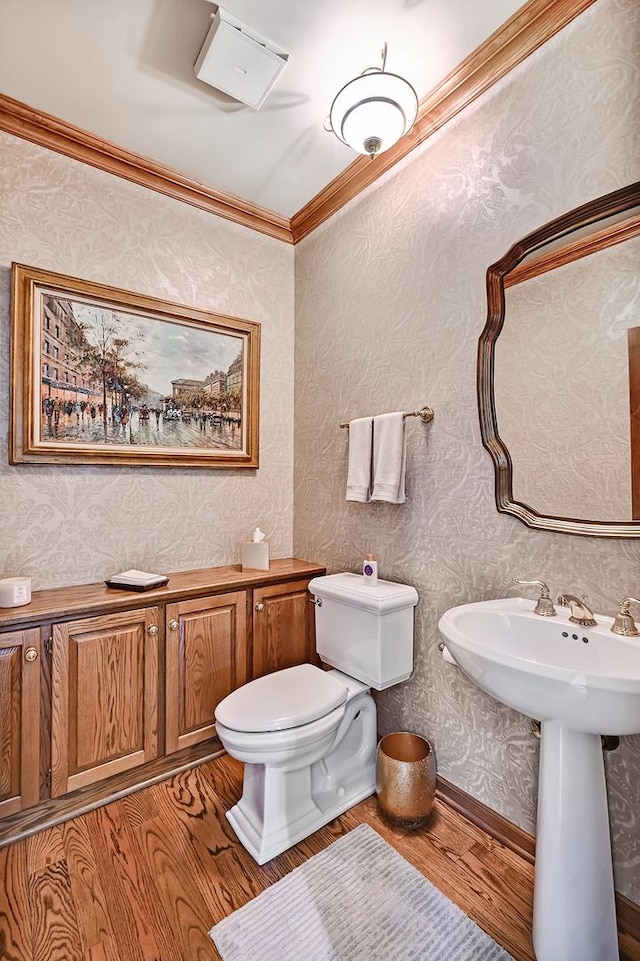 2 Hampton Ct, Burr Ridge, IL 60527 - half bath featuring ornamental molding, wood finished floors, toilet, and wallpapered walls