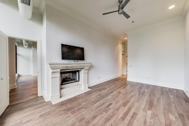333 W Hubbard St Unit 704, Chicago, IL 60654 - unfurnished living room featuring a ceiling fan, light wood finished floors, a fireplace with flush hearth, recessed lighting, and baseboards