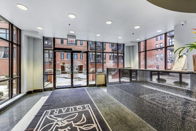 333 W Hubbard St Unit 704, Chicago, IL 60654 - community lobby with a wall of windows, recessed lighting, and a security system