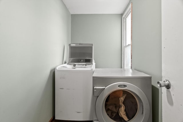 laundry area with washing machine and clothes dryer
