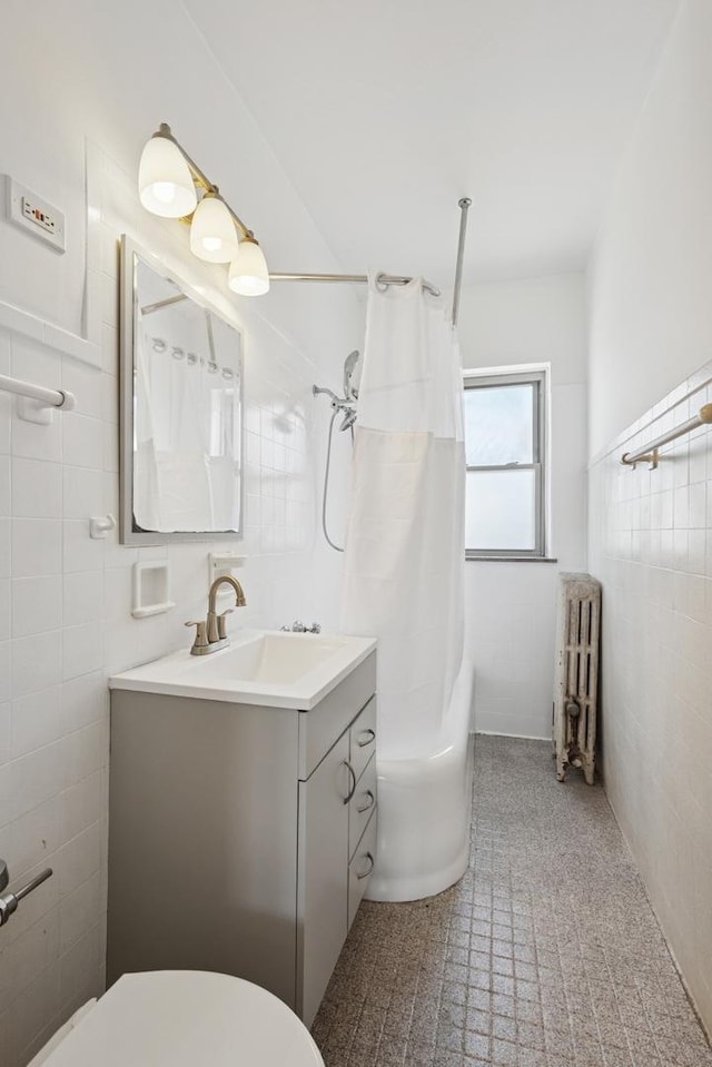 6205 N Oakley St Unit 3, Chicago, IL 60659 - full bathroom featuring radiator, tile walls, toilet, vanity, and a shower with shower curtain