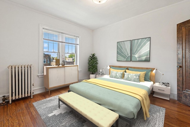 6205 N Oakley St Unit 3, Chicago, IL 60659 - bedroom featuring radiator heating unit, wood finished floors, crown molding, and baseboards