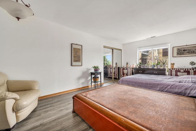 2005 Valencia Dr Unit 207D, Northbrook, IL 60062 - bedroom featuring wood finished floors, baseboards, and access to outside