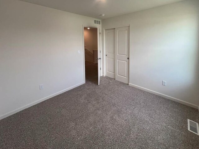 1108 58th Rd Unit 0016, Union Grove, WI 53182 - carpeted empty room with baseboards