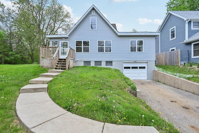 28549 W High Rd, Ingleside, IL 60041 - view of front facade with an attached garage, asphalt driveway, and a wooden deck