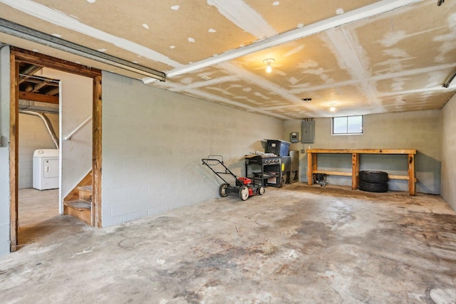28549 W High Rd, Ingleside, IL 60041 - below grade area featuring washer / dryer, electric panel, a workshop area, and concrete block wall
