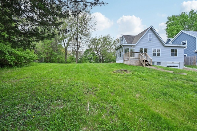 28549 W High Rd, Ingleside, IL 60041 - view of green lawn featuring an attached garage and a wooden deck