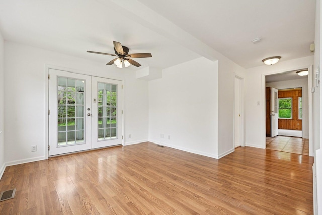 28549 W High Rd, Ingleside, IL 60041 - unfurnished room with french doors, light wood-type flooring, ceiling fan, baseboards, and a smoke detector