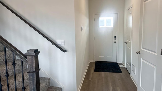 5010 Linden Rd, Mount Pleasant, WI 53403 - doorway to outside with dark wood finished floors, stairway, and baseboards