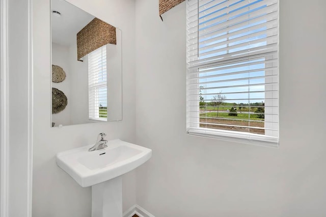 5010 Linden Rd, Mount Pleasant, WI 53403 - bathroom with healthy amount of natural light and baseboards