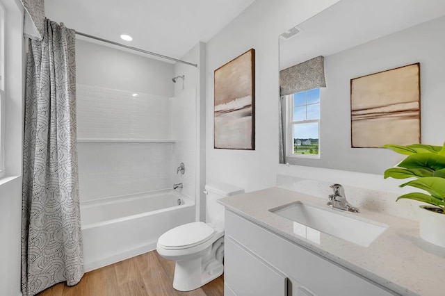 5010 Linden Rd, Mount Pleasant, WI 53403 - bathroom featuring wood finished floors, toilet, shower / tub combo with curtain, and vanity