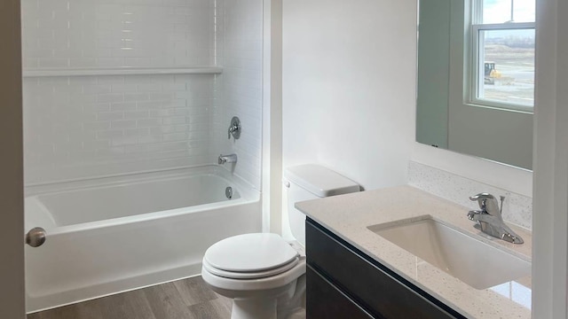 5010 Linden Rd, Mount Pleasant, WI 53403 - bathroom featuring toilet, vanity, shower / bathtub combination, and wood finished floors