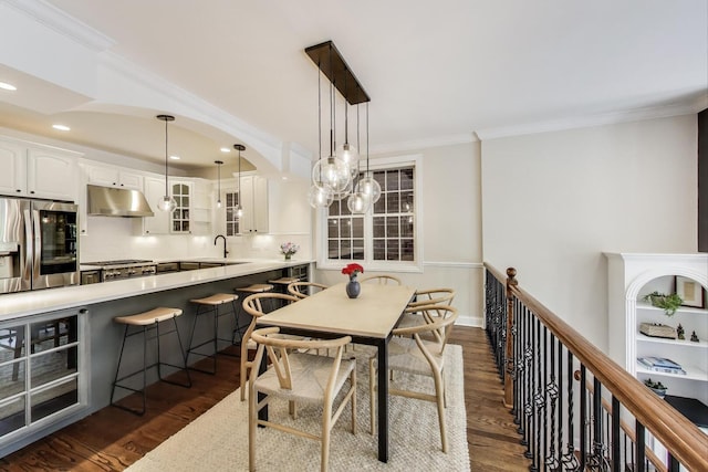3506 N Southport Ave Unit 1N, Chicago, IL 60657 - dining room featuring crown molding, dark wood-style floors, and recessed lighting