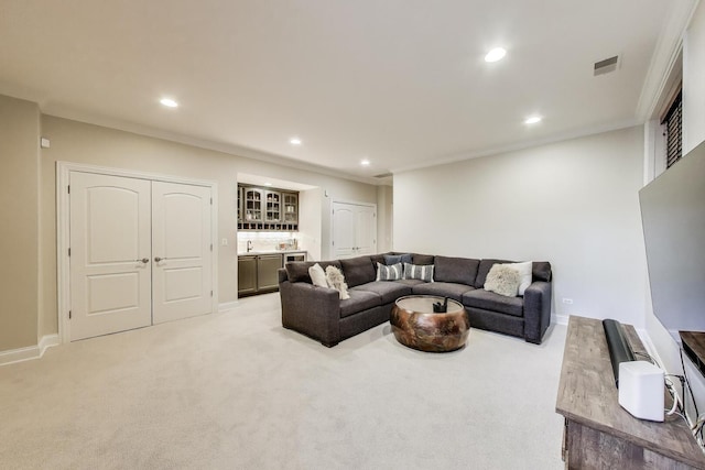 3506 N Southport Ave Unit 1N, Chicago, IL 60657 - carpeted living area with bar with sink, recessed lighting, baseboards, and ornamental molding