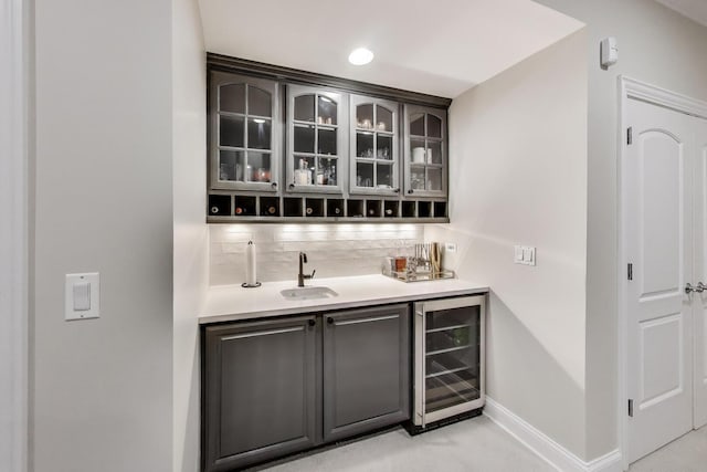 3506 N Southport Ave Unit 1N, Chicago, IL 60657 - indoor wet bar featuring wine cooler, backsplash, baseboards, and recessed lighting