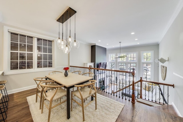 3506 N Southport Ave Unit 1N, Chicago, IL 60657 - dining room featuring a chandelier, wood finished floors, baseboards, ornamental molding, and recessed lighting