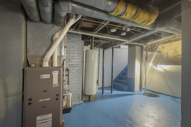 303 S Main St, Flanagan, IL 61740 - unfinished below grade area featuring water heater, stairs, and heating unit