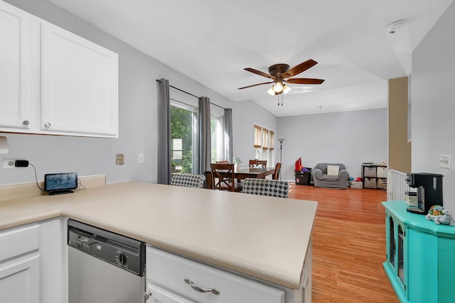 1604 Heritage Pointe Ct, Plainfield, IL 60586 - kitchen featuring stainless steel dishwasher, a peninsula, a ceiling fan, light wood finished floors, and white cabinets