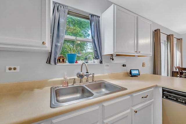 1604 Heritage Pointe Ct, Plainfield, IL 60586 - kitchen with dishwasher, a sink, and white cabinets