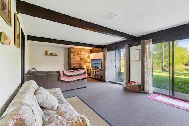 living area with carpet floors and beamed ceiling