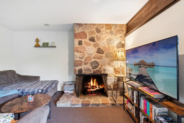 living area with a fireplace and carpet flooring
