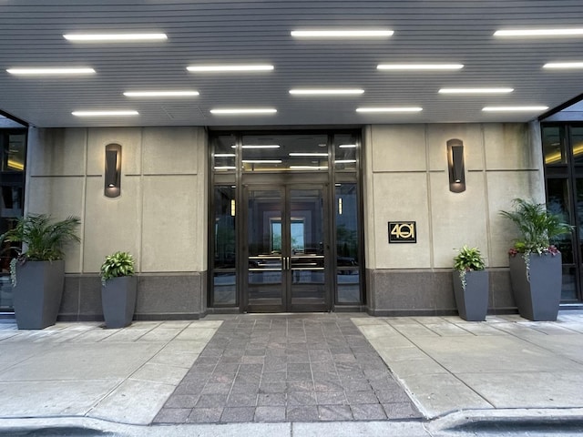 view of exterior entry featuring french doors
