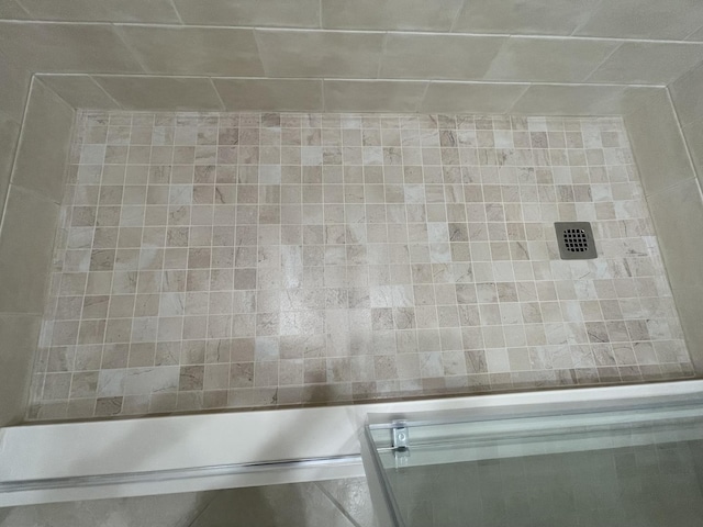 full bathroom with a shower with shower door