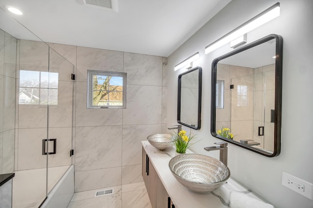 7523 Franklin St, Forest Park, IL 60130 - bathroom featuring a shower with shower door and double vanity