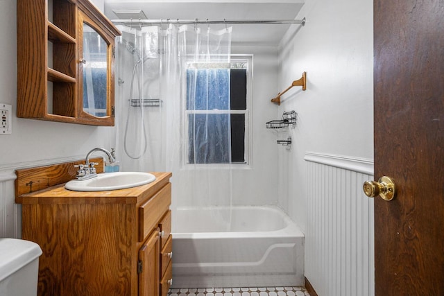 bathroom with toilet, shower / washtub combination, and vanity