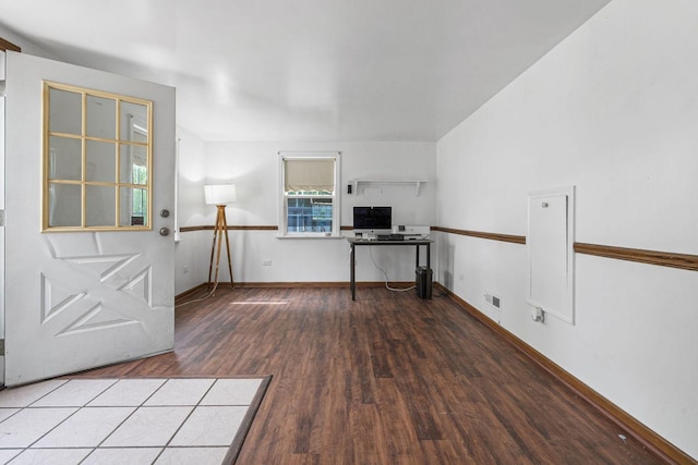 entrance foyer featuring wood finished floors and baseboards