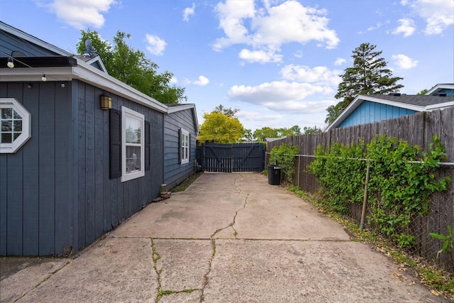 fenced backyard with a patio