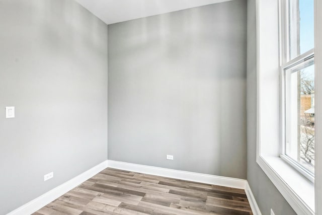 1806 S Trumbull Ave, Chicago, IL 60623 - empty room featuring healthy amount of natural light, baseboards, and light wood-type flooring