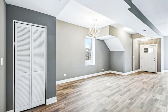 1806 S Trumbull Ave, Chicago, IL 60623 - bonus room with healthy amount of natural light, a chandelier, light wood finished floors, and baseboards