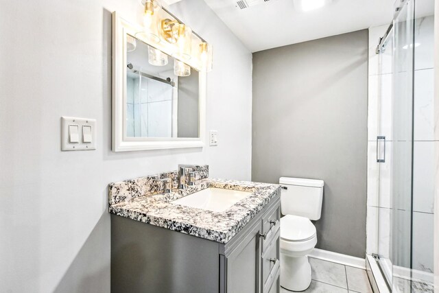1806 S Trumbull Ave, Chicago, IL 60623 - bathroom with a stall shower, toilet, vanity, baseboards, and tile patterned floors