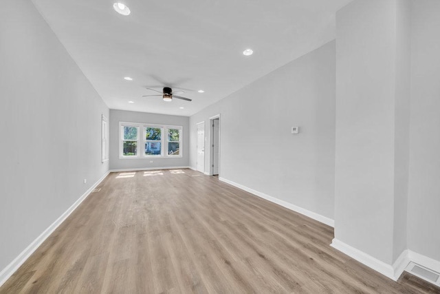 14631 Vincennes Rd, Harvey, IL 60426 - unfurnished living room with light wood-type flooring, a ceiling fan, baseboards, and recessed lighting